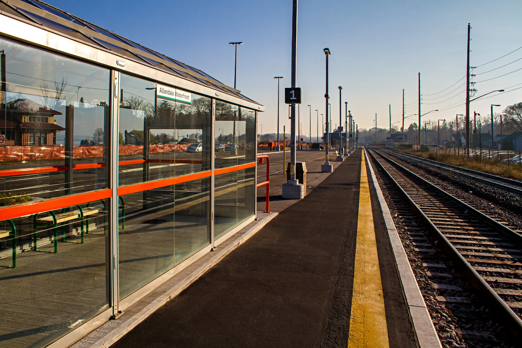 Allandale Waterfront GO Station platfrom with shelter and tracks