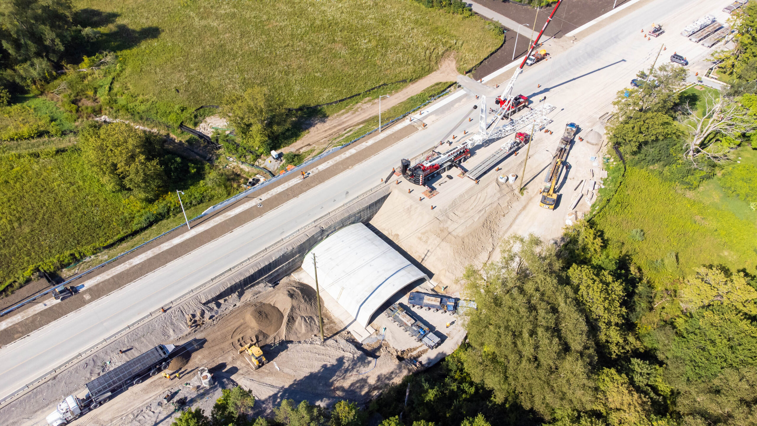 Drone image showing concrete arch install for bridge